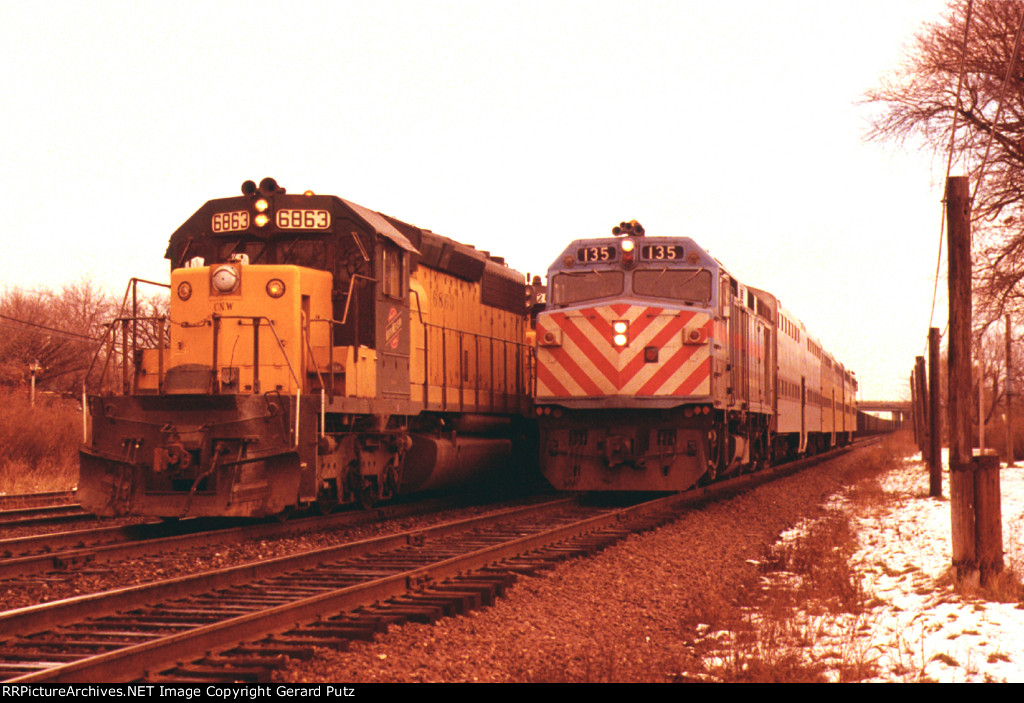 w/b RTA Train Overtaking w/b C&NW Empty Coal Train